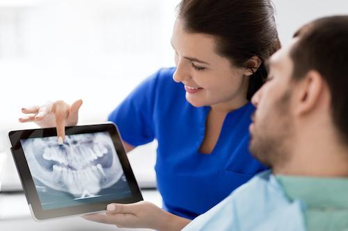 showing a patient his dental x-rays