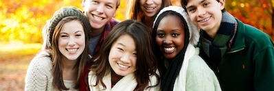 A group of friends smiling in fall weather | wisdom teeth extraction pacifica ca