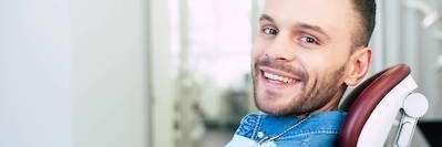 Man smiling in the dentist's chair