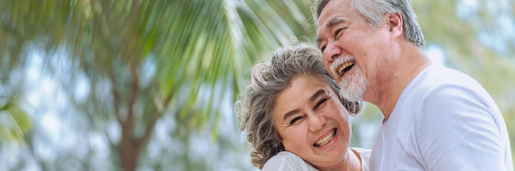 An elderly couple with dentures in Pacifica, CA