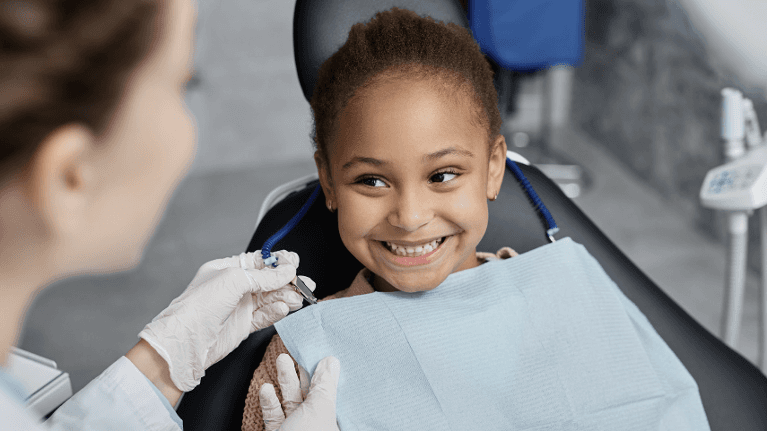 A little girl at Cabrillo Family dental care being attended to by Dr Sarah Esmaili
