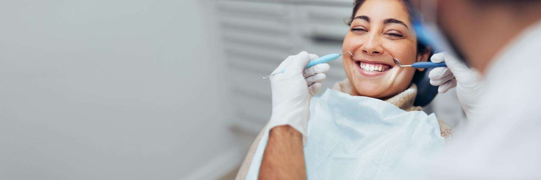 a woman getting root canal in Pacifica, CA