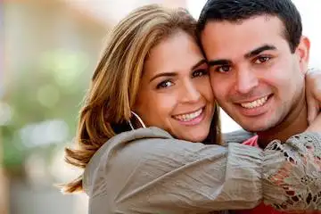 A young couple hugging each other