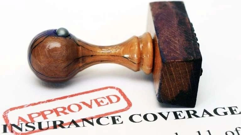 A stamp of approved signifying insurance coverage