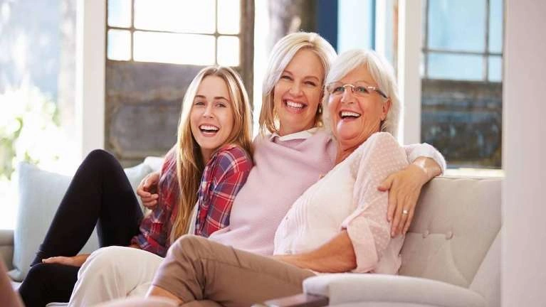 Multi generational family posing for a photo