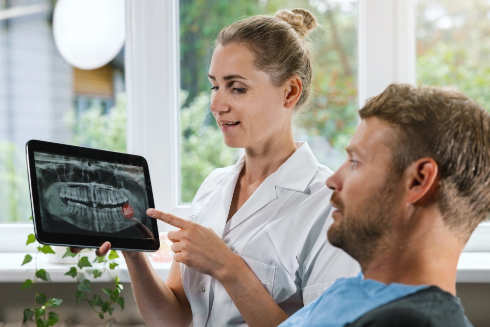 Doctor explaining x ray to a patient