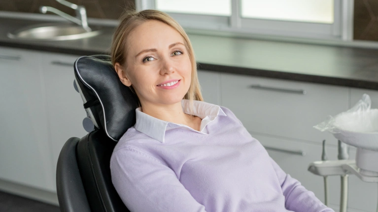 A woman sitting in a dental chair